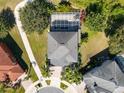 Top-down view of a two-story house with a pool and fenced enclosure at 13438 Davenham Pt, Orlando, FL 32832