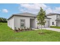 Attractive single-story home with a well-manicured lawn and small landscaping, offering great curb appeal at 13469 Leaping Water Way, Astatula, FL 34705