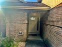 Front entry with brick facade and light-colored door at 341 N Fork Dr, Lakeland, FL 33809