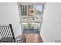 Bright entryway featuring a spiral staircase, hardwood floors, and a modern starburst chandelier at 150 E Robinson St # 221, Orlando, FL 32801