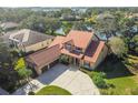 Two-story house with three car garage and lake view at 2024 Capri Ln, Mount Dora, FL 32757
