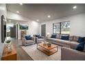 Bright living room featuring recessed lighting, modern decor, and a large window with natural light at 7631 Lewis Rd, Lakeland, FL 33810