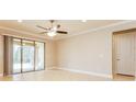 Bright living room with tile floors and sliding glass doors to patio at 368 Toldedo Rd, Davenport, FL 33837