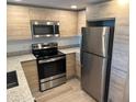 Modern kitchen with stainless steel appliances at 1210 Southstation Pl # 202, Orlando, FL 32809