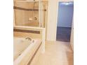 Bright bathroom features a jacuzzi tub and a large, clear shower at 745 Marsh Reed Dr, Winter Garden, FL 34787