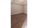 Empty bedroom boasts new wood floors and a recessed ceiling light at 745 Marsh Reed Dr, Winter Garden, FL 34787
