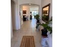 Light-filled entryway featuring tile floors and access to other rooms at 478 Disa Dr, Davenport, FL 33837