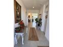 Bright and spacious foyer with tile flooring and decorative plants at 478 Disa Dr, Davenport, FL 33837