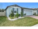 House exterior with landscaping, and a gray color scheme at 3052 Cassidy Ln, Haines City, FL 33844