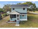 Inviting two-story home featuring a cozy screened porch and well-maintained yard at 5431 9Th Se St, Lakeland, FL 33812