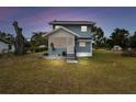 Cozy two-story home featuring a charming screened porch and a well kept lawn at 5431 9Th Se St, Lakeland, FL 33812