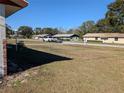 View of a quiet residential street with houses at 2150 Ne 54Th St, Ocala, FL 34479