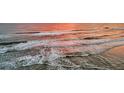 Aerial view of ocean waves at sunset at 3737 S Atlantic Ave # 204, Daytona Beach Shores, FL 32118
