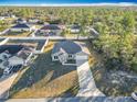 House with driveway and surrounding homes visible at 16962 Sw 40Th Cir, Ocala, FL 34473