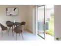 Dining area with table and chairs, and sliding glass door to patio at 673 Bell Prairie Cir, Lake Wales, FL 33859