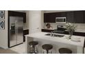 Modern kitchen with stainless steel appliances and island at 673 Bell Prairie Cir, Lake Wales, FL 33859