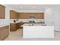Modern kitchen with stainless steel appliances, shaker cabinets, white quartz countertops and island at 4471 Sw 84Th Street Rd, Ocala, FL 34476