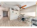 Bright dining room with tile flooring, ceiling fan and lots of natural light at 6141 Palmetto Dr, Indian Lake Estates, FL 33855