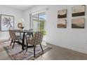 Bright dining room with a table for four and access to the backyard at 5639 Loggia Ln, Kissimmee, FL 34758