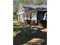 Peaceful front yard with a wooden swing at 2300 Se 73Rd Loop, Ocala, FL 34480