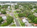 Aerial view highlights the home's location near the lake and surrounding landscape at 415 Avenue K Ne, Winter Haven, FL 33881