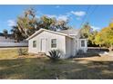 Updated single story home with a neutral color scheme and landscaping at 521 W Voorhis Ave, Deland, FL 32720