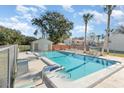 Community pool with surrounding patio and lounge chairs at 980 Canal View Blvd # G1, Port Orange, FL 32129