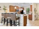 Kitchen with granite countertops and a breakfast bar at 1463 Myrtlewood St, Davenport, FL 33896