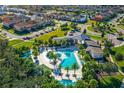 Community pool and clubhouse with surrounding homes at 2541 Shanti Dr, Kissimmee, FL 34746