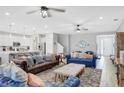 Spacious living room with comfortable seating and access to the kitchen at 2541 Shanti Dr, Kissimmee, FL 34746
