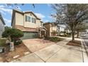 Two-story house on tree-lined street with brick driveway at 501 Lasso Dr, Kissimmee, FL 34747
