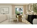 Bright dining room with round wooden table and six beige chairs at 1339 Inkberry Cir, Deland, FL 32720