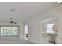 Spacious living room with an open floor plan and access to a lanai at 3379 Fiddle Leaf Way, Lakeland, FL 33811