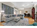 Bright and airy living room with hardwood floors and comfortable seating at 1011 Susan Dr, Lake Wales, FL 33853