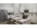 Modern kitchen with stainless steel appliances and white cabinets at 1621 Hummingbird Rd, Winter Haven, FL 33884