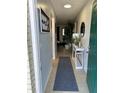 Bright and spacious entryway with decorative rug and console table at 401 Century Blvd # C, Auburndale, FL 33823