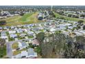 Community overview showcasing numerous homes and a golf course at 1724 Magnolia Ave, Lady Lake, FL 32159