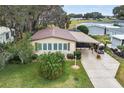Single-story home with carport and well-maintained landscaping at 1724 Magnolia Ave, Lady Lake, FL 32159