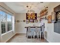 Home bar with rustic wood and metal finishes, including a dartboard at 8710 Hinsdale Heights Dr, Polk City, FL 33868