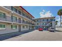 Two-story building with balconies and parking area at 900 S Peninsula Dr # 102, Daytona Beach, FL 32118