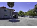 Parking area with building and palm trees in view at 900 S Peninsula Dr # 102, Daytona Beach, FL 32118