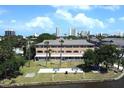 Aerial view of waterfront apartment building with green space at 411 N Halifax Ave # 104, Daytona Beach, FL 32118