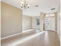 Bright living room with neutral paint, tile floors, and lots of natural light at 4026 Navigator Way, Kissimmee, FL 34746