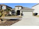 Single-story house with attached garage and landscaped front yard at 2180 Nighthawk Dr, Haines City, FL 33844