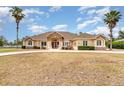 Single-story house with stone accents and a large yard at 2715 Sw 177Th Place Rd, Ocala, FL 34473