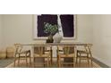 Dining room featuring a rustic wooden table and six chairs at 4807 Waltham Forest Dr, Davenport, FL 33837
