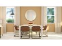 Bright dining room with a square table and four brown leather chairs at 2653 Skyline Loop, Kissimmee, FL 34758