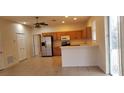 Kitchen with stainless steel appliances and light wood cabinets at 2938 Egrets Landing Dr, Lake Mary, FL 32746