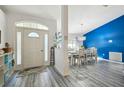 Open entryway, view of dining area with blue accent wall at 14544 Sw 112Th Cir, Dunnellon, FL 34432