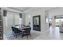 Elegant dining room with a wooden table and modern chairs at 1955 Rider Rain Ln, Apopka, FL 32703